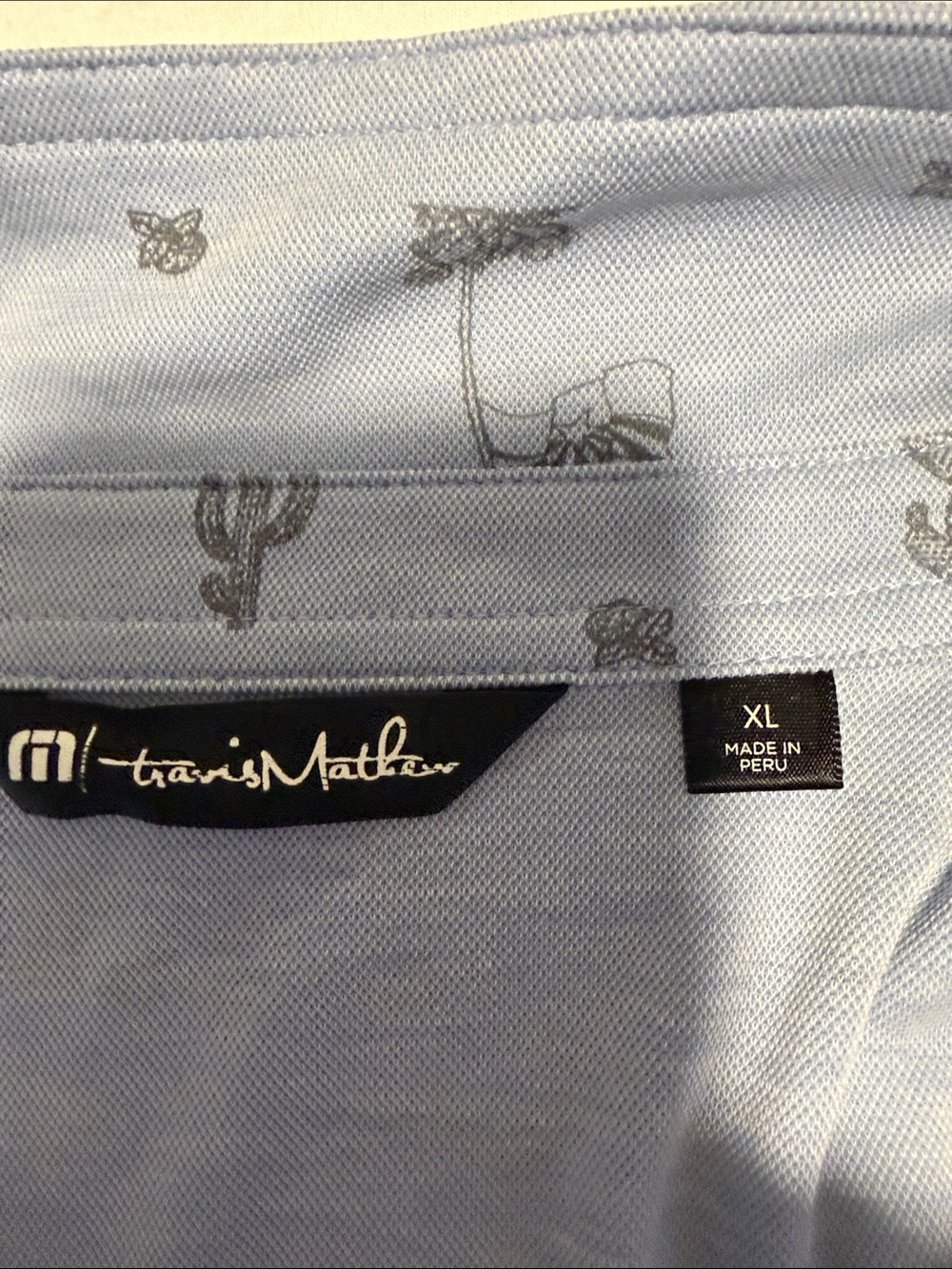 Travis Mathew Light Blue Polo with Gray Desert Motif